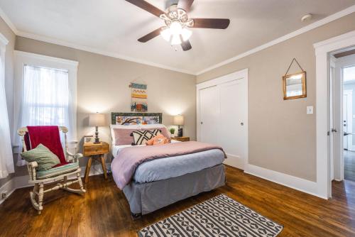 a bedroom with a bed and a ceiling fan at 738 E Yale in Fresno