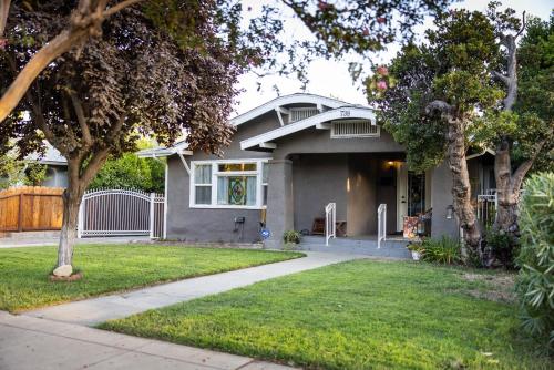 a gray house with a driveway in front of it at 738 E Yale in Fresno