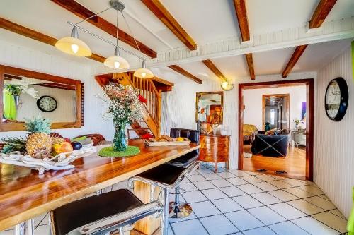 a kitchen with a counter and a dining room at Les Terrasses du Volcan in Le Tampon