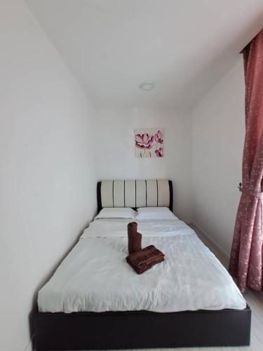 Posteľ alebo postele v izbe v ubytovaní Chill Stay @Sutera Avenue