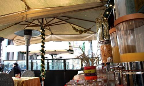 a table with a large umbrella in a restaurant at Di Rienzo Pantheon Palace in Rome