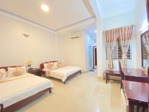 Giường trong phòng chung tại Du Hung 2 Hotel