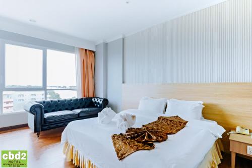 Un ou plusieurs lits dans un hébergement de l'établissement CBD 2 Hotel