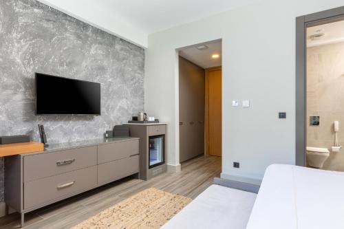 TV a/nebo společenská místnost v ubytování Unique Life Style Hotel