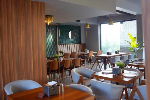 a dining room with tables and chairs in a restaurant at Sky Roof Hotel in North Nicosia