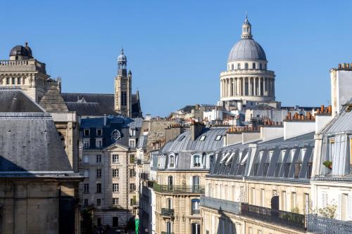 a view of the city of london from the roofs of buildings at Hotel Abbatial Saint Germain in Paris
