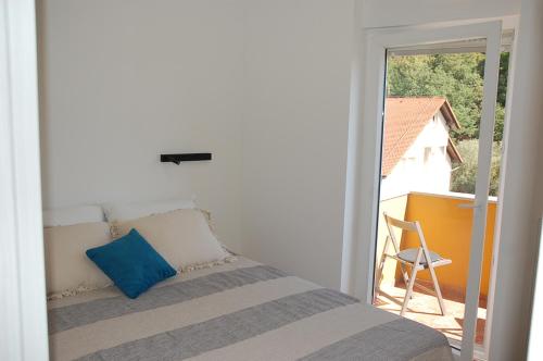 Posteľ alebo postele v izbe v ubytovaní Apartman Vrhovec