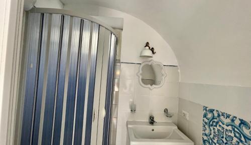 a bathroom with a shower and a sink at Villa Striano Capri in Capri