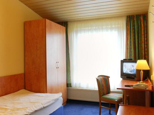 Postel nebo postele na pokoji v ubytování Kärntner Stub'n