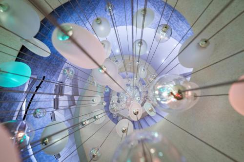 a chandelier hanging from a ceiling at FIVE Zurich - Luxury City Resort in Zürich