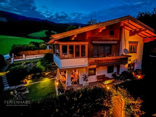 an aerial view of a house with a yard at Gartenwohnung an der Familienabfahrt in Brixen im Thale