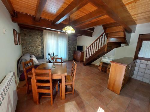 a living room with a wooden table and chairs at Casa Moreno in Hospital