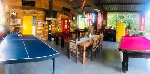 a room with a ping pong table in a restaurant at Fazenda Quinta da Esperança- Pousada e Lazer in Tiradentes