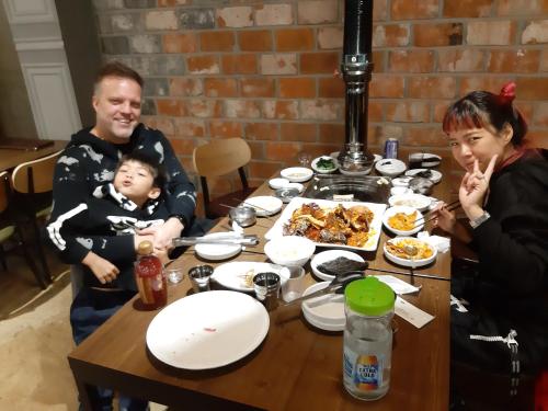 a man and a woman sitting at a table with food at Heidi Korea in Hongcheon