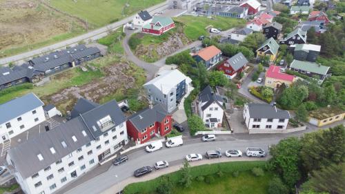 an aerial view of a town with cars parked on a street at Tórshavn Apartment - City Center in Tórshavn