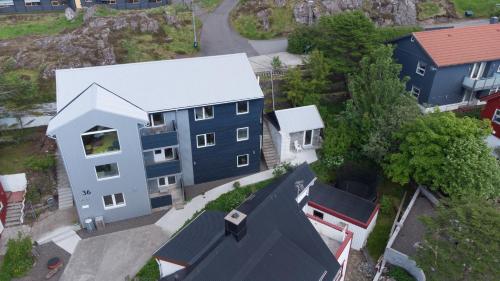 an overhead view of a blue house and some buildings at Tórshavn Apartment - City Center in Tórshavn