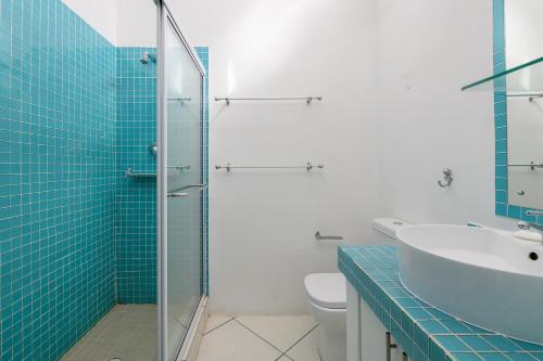 a bathroom with a sink and a glass shower at San Lameer Villa 2832 - 3 Bedroom Classic - 6 pax - San Lameer Rental Agency in Southbroom