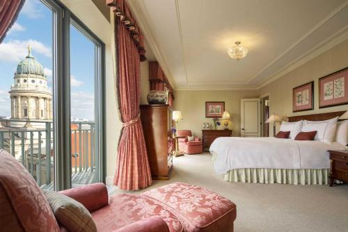 a hotel room with a bed and a large window at Regent Berlin, an IHG Hotel in Berlin