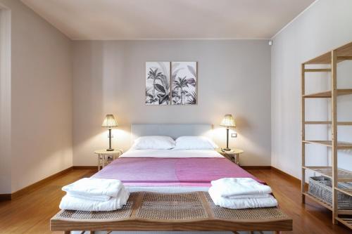 En eller flere senge i et værelse på Castello Luxury Apartment - in the heart of Milan