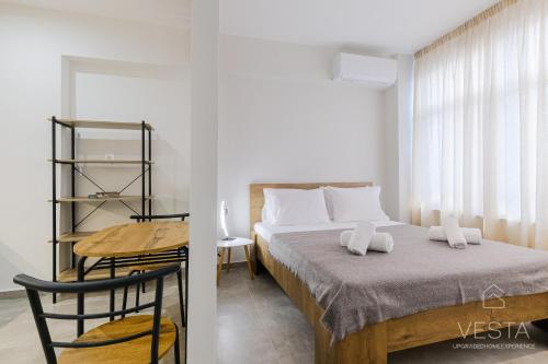 Ένα ή περισσότερα κρεβάτια σε δωμάτιο στο Ellis Paradise City Apartments, Vesta Philoxenia
