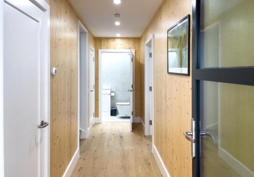 a hallway of a bathroom with a toilet and a door at Green Mews 3 with Free Parking - By My Getaways in Brighton & Hove