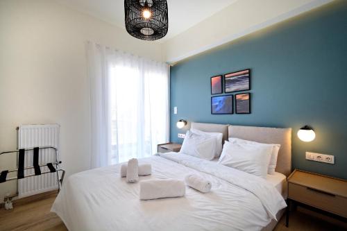 Posteľ alebo postele v izbe v ubytovaní Eos Residence