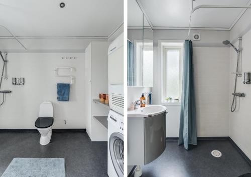 ein Badezimmer mit einem Waschbecken und einer Waschmaschine in der Unterkunft Luxury holiday home in Tallbacken with lake views over Bolmen in Ljungby