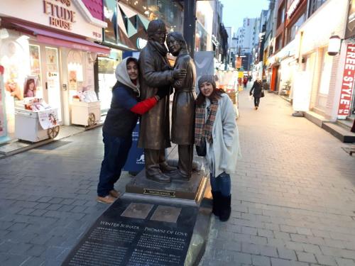 a group of people standing next to a statue at Heidi Korea in Hongcheon