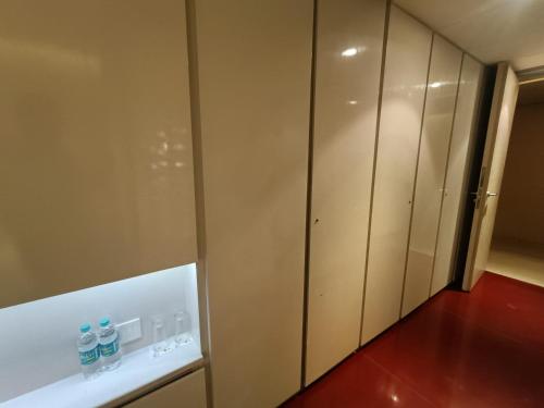 a locker room with two bottles of water in it at Boulevard by Design Hotel Chennai in Chennai