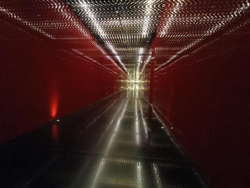 a tunnel with red and white lights at night at Boulevard by Design Hotel Chennai in Chennai