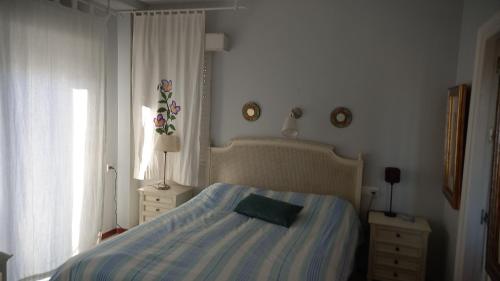 A bed or beds in a room at Magnífico piso en la playa