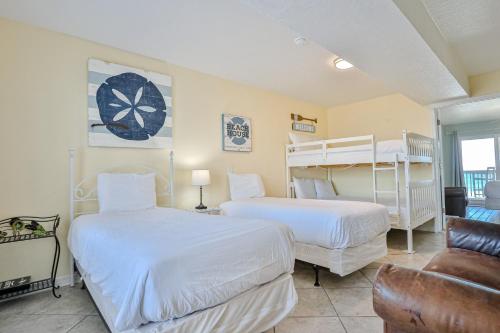 a bedroom with two beds and a couch at Summer Haven D in Destin