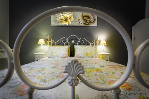 a bedroom with a bed with a metal frame at Cosy near centre Edinburgh apartment in Edinburgh