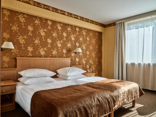 Katil atau katil-katil dalam bilik di Hotel Great Polonia Kraków Airport