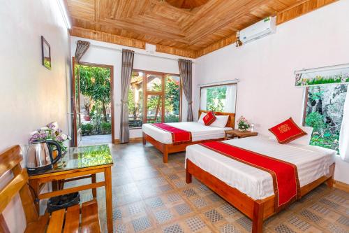 a bedroom with two beds in a room at Tam Coc mountain bungalow in Ninh Binh