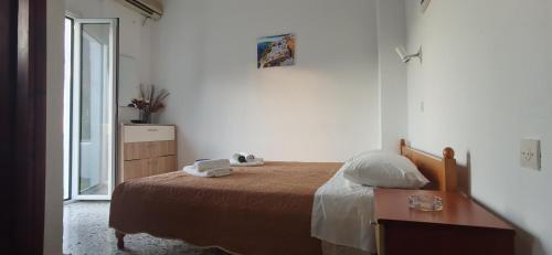 Ένα ή περισσότερα κρεβάτια σε δωμάτιο στο Paradise
