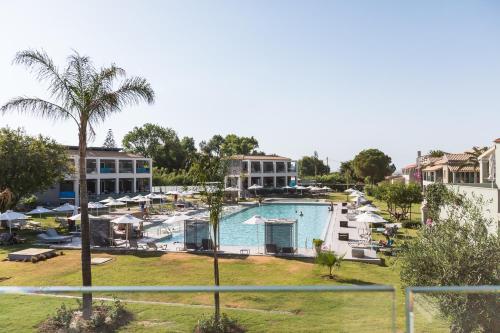 a view of a pool at a resort at Acharavi Beach Hotel in Acharavi