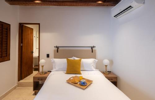 Cama o camas de una habitación en Hotel Voilá Getsemaní