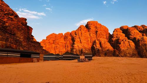 a view of a canyon with red rocks at Bedouin host camp& with tour in Wadi Rum