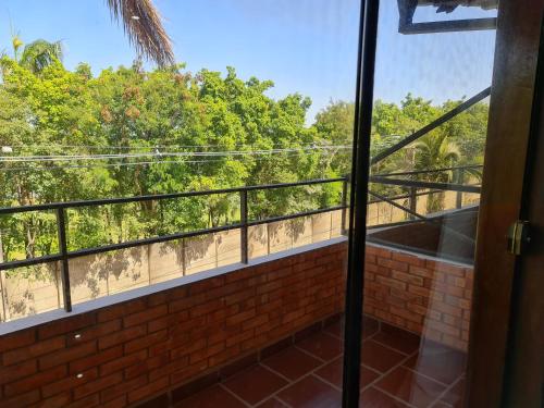 a balcony with a view of the trees at Terrazas Vista Verde in Asuncion