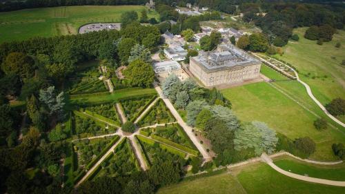 an aerial view of a large building in a park at Home Farm rooms in the grounds of Wentworth Castle in Barnsley