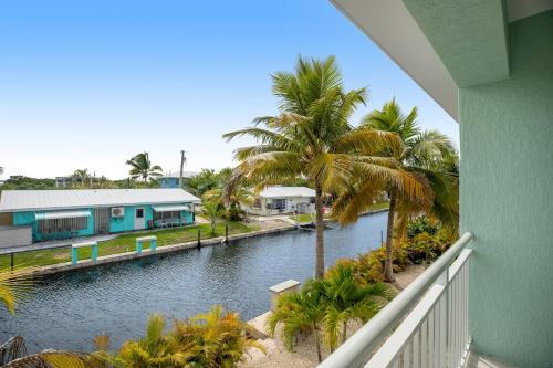 a view of a river from a balcony of a house at Sunset Villa in Big Pine Key