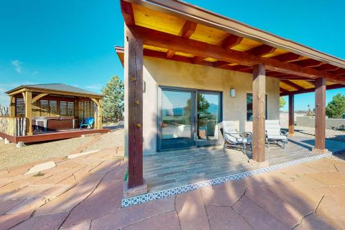 a patio with a gazebo and a house at Cottam Pines B - Permit #9228 in Taos