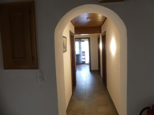 a hallway with an archway in a house at Apartment Fischer in Tarrenz