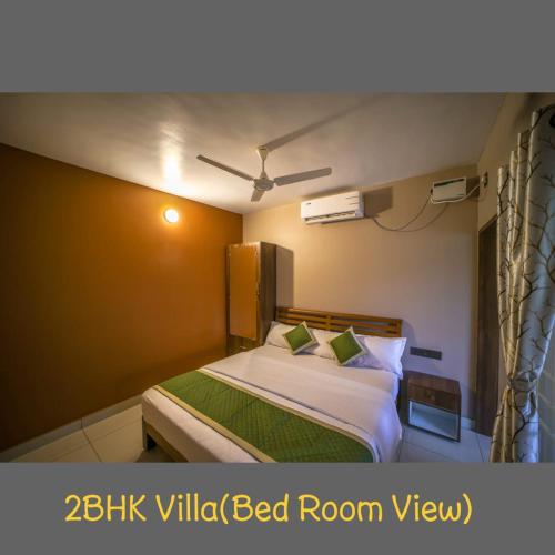 Postel nebo postele na pokoji v ubytování Mukhil Paradise Villa