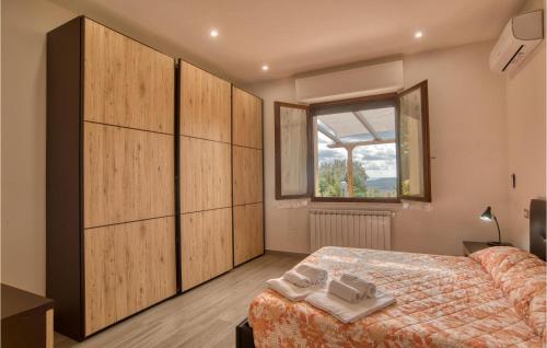 Katil atau katil-katil dalam bilik di Amazing Home In Chianciano Terme