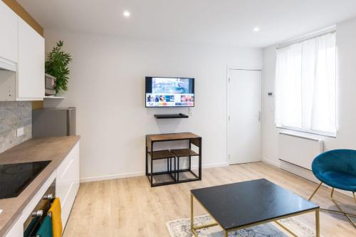 Η κουζίνα ή μικρή κουζίνα στο Désirée Logement Cosy et Charmant 1 er étage