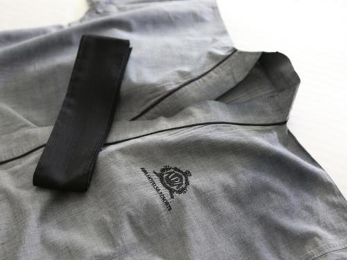 a black tie sitting on top of a gray shirt at APA Hotel Sendai Eki Itsutsubashi in Sendai