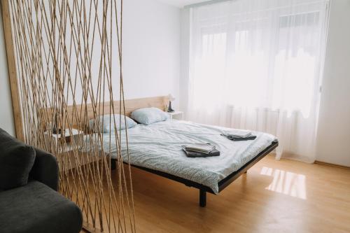 a bedroom with a bed with a net at Constantin Inn in Niš