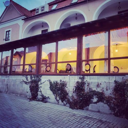 a building with a lot of windows on it at Kaštieľ Ottlýk in Bánovce nad Bebravou